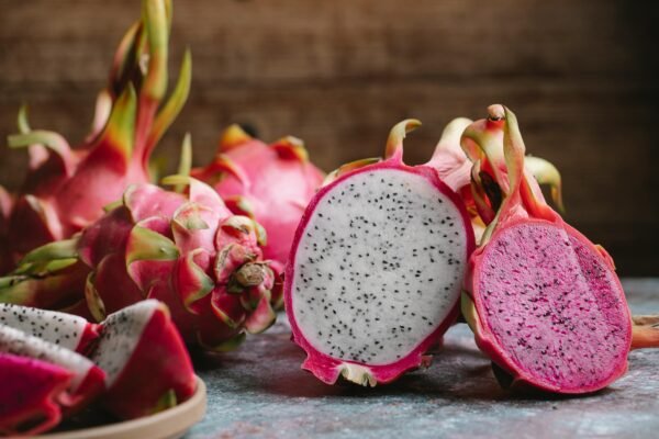 Vibrant dragon fruits displayed in a close-up showcasing their unique texture and color.